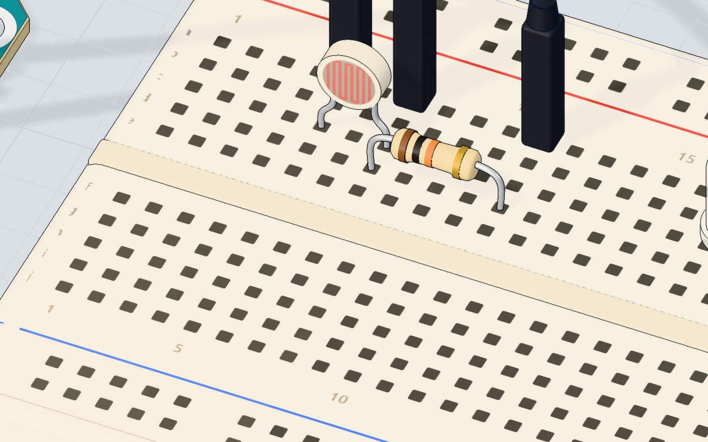 Close-up of the LDR with its wavy track next to the 10 kΩ resistor
