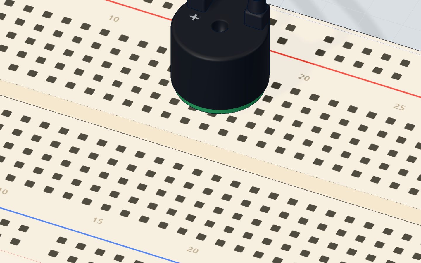 Close-up of the round buzzer with its + leg marked